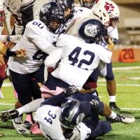 EHS football_triple team