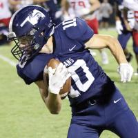Brayden Girard turns to run after making a catch