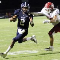 Dorian Plumley eludes a Cache tackler