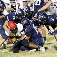 EHS football_Gang tackle Demon