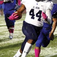 EHS football_Moore running through rain