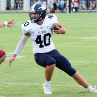 Kolton Hunt tries to avoid a Weatherford tackler