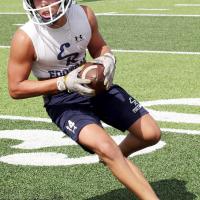 Hunter Davidson turns upfield after catching a pass