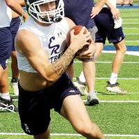 Xavior Devereaux turns upfield after catching a screen pass
