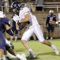 Hunter Davidson runs the ball