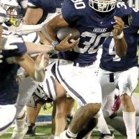 Antawan Grayson looks upfield after breaking the line of scrimmage