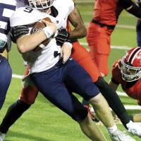 Rustyn Cook fights for extra yards on a run