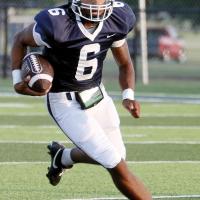 Elijah Fisher runs a sweep play