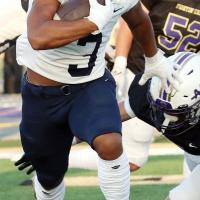 Malachi Nicholson breaks to the outside to elude a Chickasha tackler