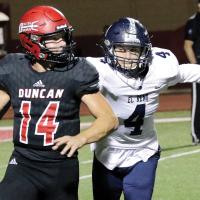Xavier Devereaux tries to run down Duncan’s quarterback