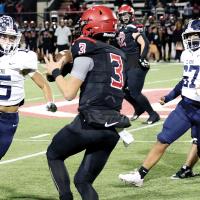 Daylin Pruitt, Jaron Youngbear and Keaton Dennis cut off an escape route for Duncan quarterback Sawyer Rice