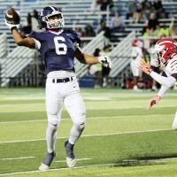 Antawan Grayson throws a touchdown pass in the win over Lawton