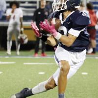 Kobe Little clutches the pass that turned into his game-winning 59-yard touchdown against Lawton
