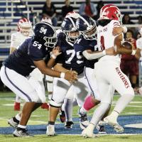 Tristan Elledge (54), Toby Sheridan (75) and Kaleb Dennis tackle a Lawton ball carrier