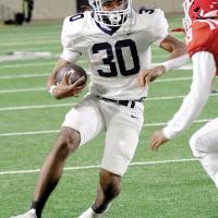 Antawan Grayson attempts to dodge a Lawton defender
