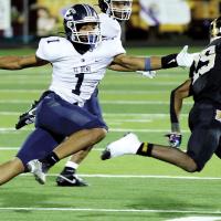 A Midwest City runner tries to elude Kaleb Blackwolf