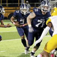 Ryan Sigler blocks for running back Malachi Nicholson