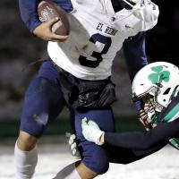 Malachi Nicholson tries to dodge a Bishop McGuinness defender