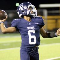 Elijah Fisher throws on the run