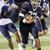 Grant First catches a block from a teammate on a run