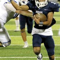 Devonne Smith pushes past a tackler after picking off a pass