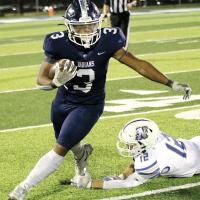 Malachi Nicholson (3) runs through an ankle tackle