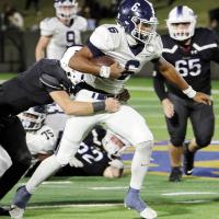 Antawan Grayson pulls a Noble tackler for extra yards
