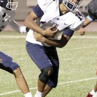Martin Perez takes a handoff from backup quarterback Donovan Mahseet
