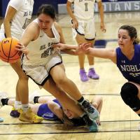 EHS girls basketball_Sioux steps through two defenders