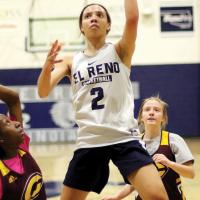 EHS girls basketball_Evans-Thompson slips between defenders