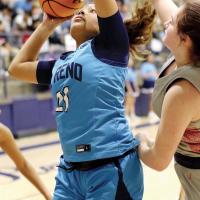 Pauline Black-Harmon eyes the basket while shooting in traffic