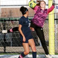 Bri Vickers knocks down a shot