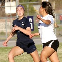 Caroline Huber eyes a high-bouncing ball