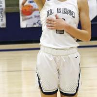Ashlyn Evans-Thompson waves to the crowd after setting the school record