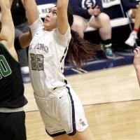Carley Kihega reaches high for a rebound