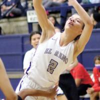 Ashlyn Evans-Thompson is fouled while shooting a jumper