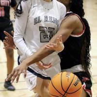 Tetona Blackowl gets bear-hugged by a Del City defender