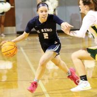Ashlyn Evans-Thompson tries to avoid contact with a defender