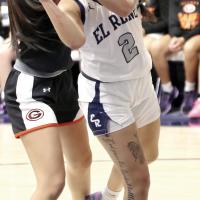 Juliana Thomas takes two arms to the face while trying to jump through a double team