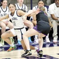 Juliana Thomas gets pinned by an OKC Knights defender as she fights for control of a loose ball