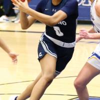 Janae Black-Harmon drives past a defender