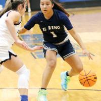 Jaylin Reveles dribbles up to a Harrah defender