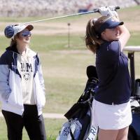 Addysen Ashford watches her tee shot on the 14th hole