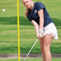 Radley Miller watches her chip shot on the 16th hole at Lincoln Park