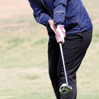 Kallie Maifield watches her putt roll toward the cup