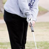 Skylar Ayers watches a putt roll toward the hole