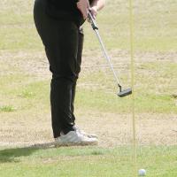 Skylar Ayers putts the ball toward the hole
