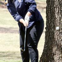 Madison Patswald hits from around a tree