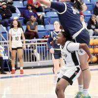 Lilly Thomas gets hooked and fouled by an Eagles defender
