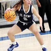 Phallyn McHenry-Guzman looks for a passing lane while dribbling the ball